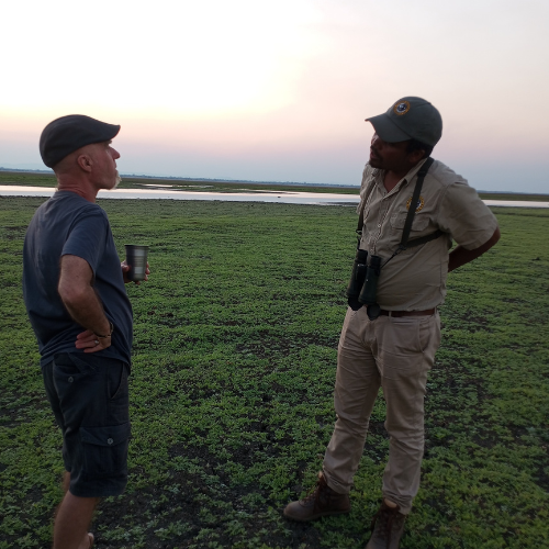 Guide in Gorongosa National Park talking to tourist