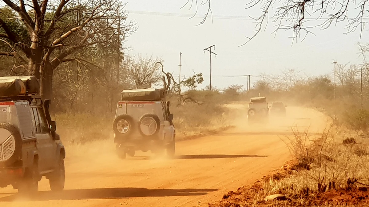 4x4 vehicles on safari adventure in the wilderness of southern Africa.