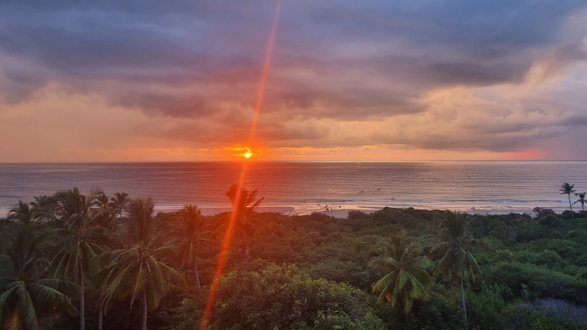 Golden sunrise over a quiet, untouched beach in Mozambique